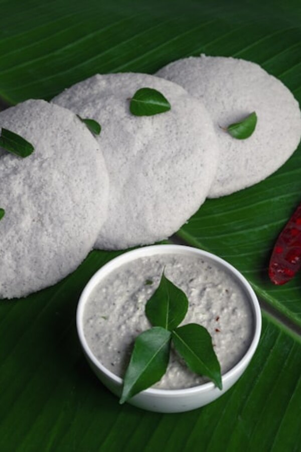 Prepared lotus-root slices and puree on a leaf